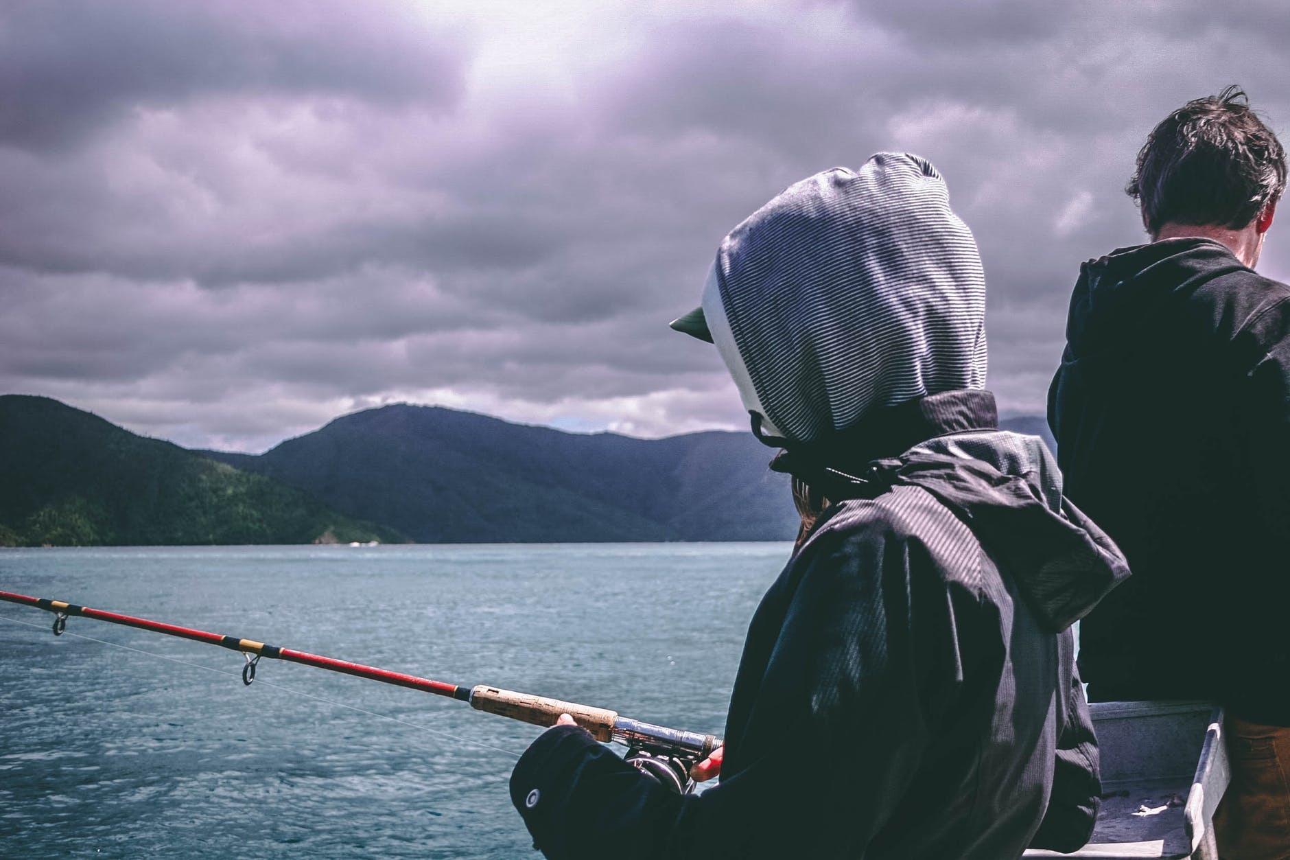 two men fishing