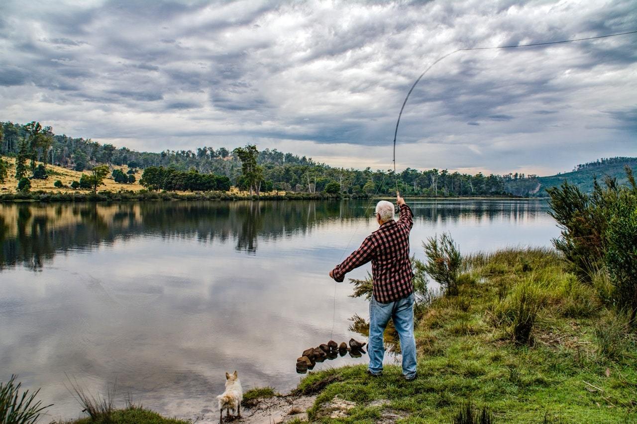 Old man fishing on the lake