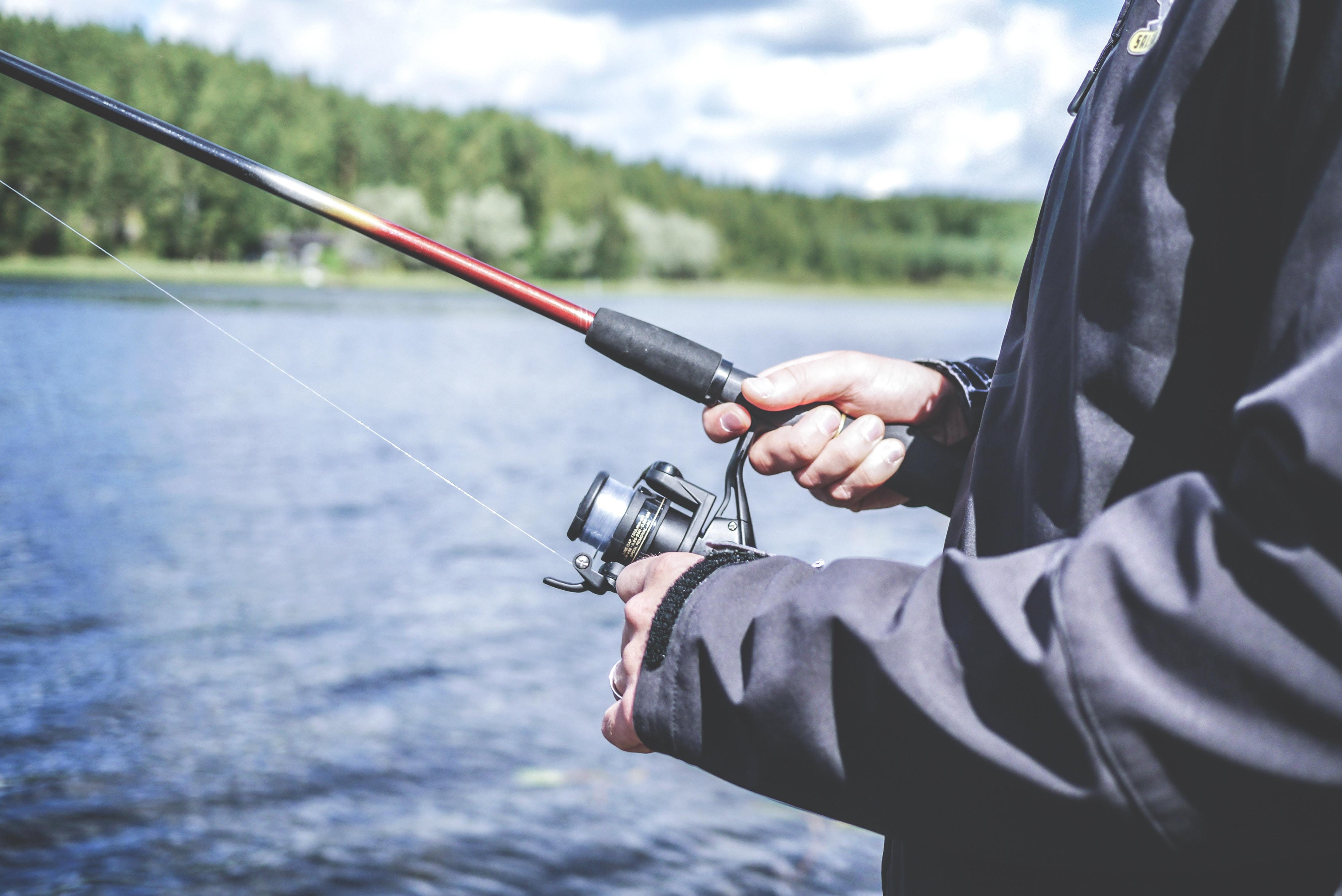 Fisherman holding the best fishing rods